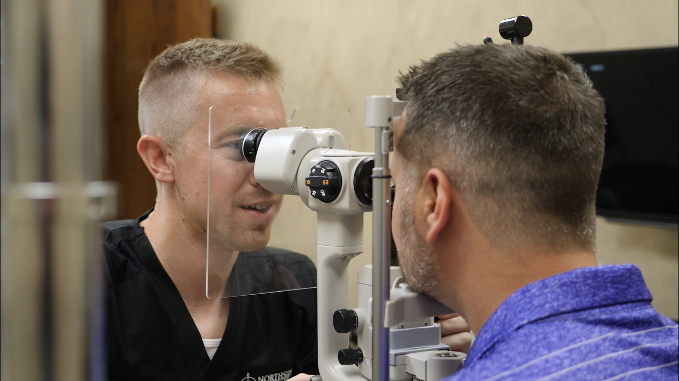 Caleb Chesnut performing optometry