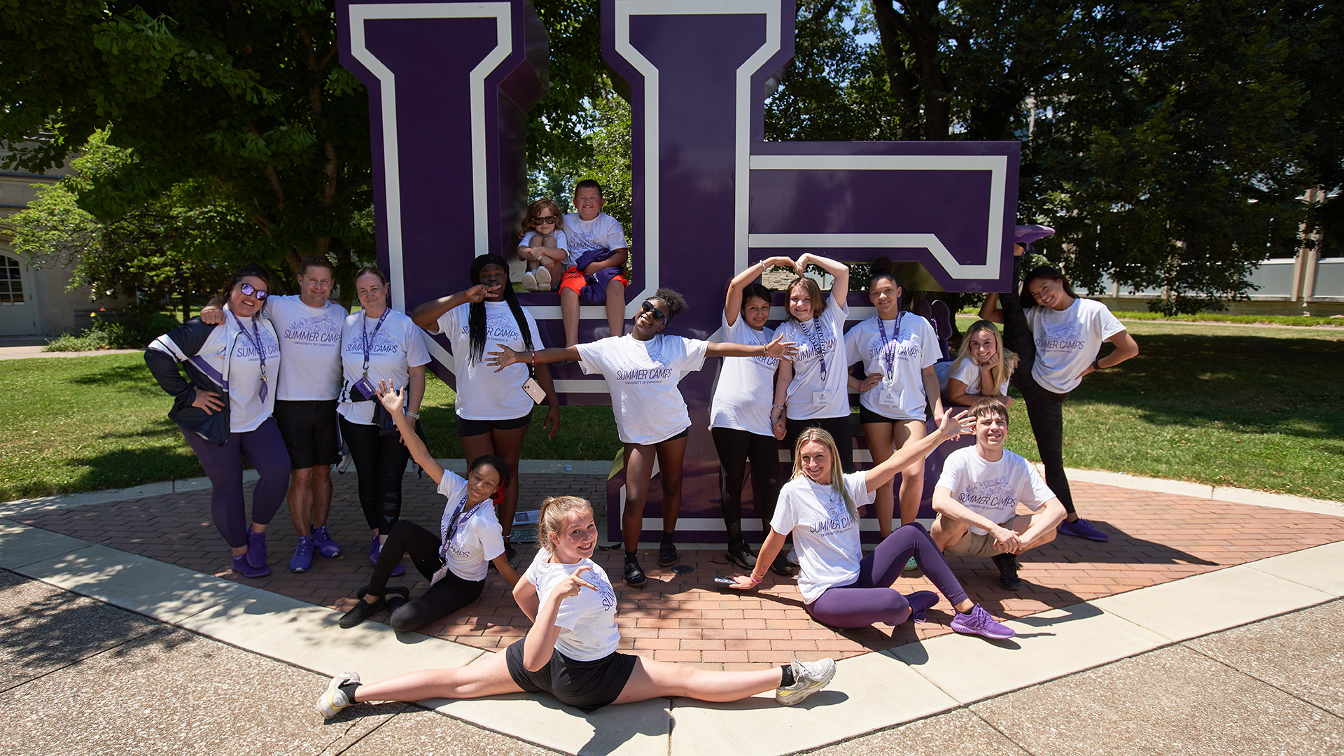 Dance Camp students at UE letters sign