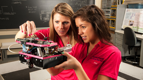 Two students with a robot