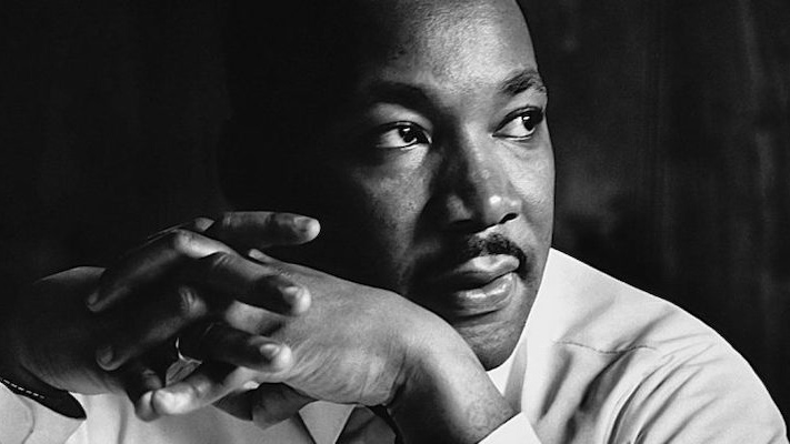 Martin Luther King Jr. with hands folded