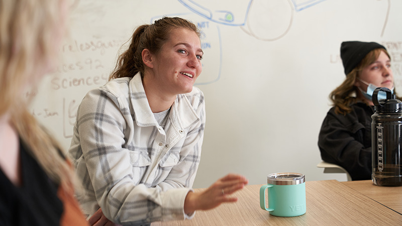 Girl in meeting with coffee