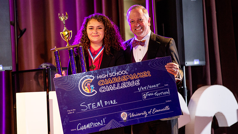 STEMpire winner and PrezP holding check