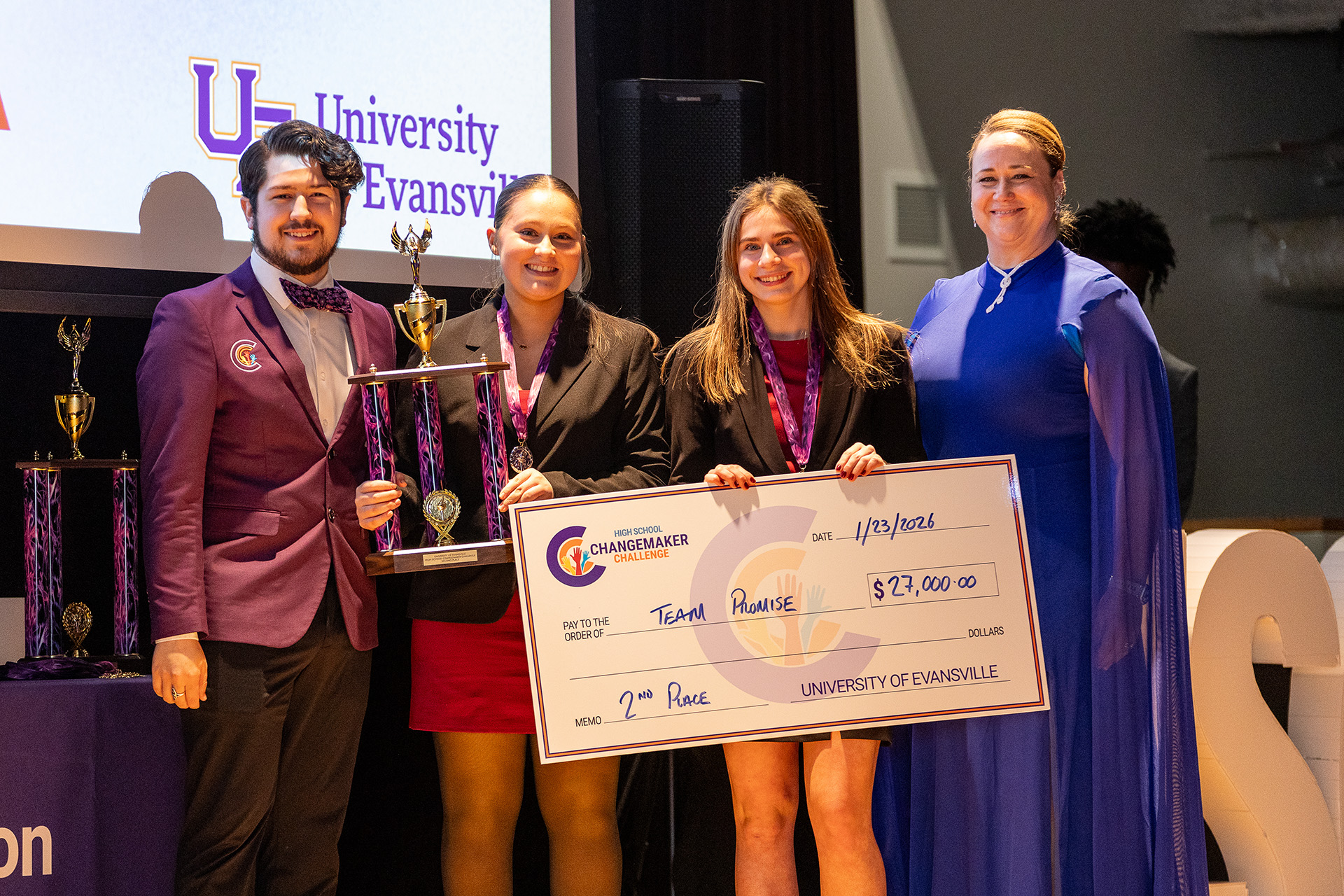 Team Promise holding winning check.