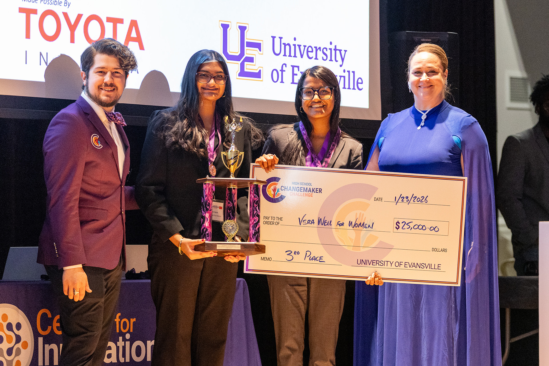 Team VeraWell for Women holding winning check.