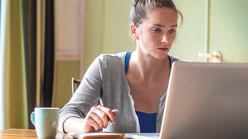 Student at laptop at home