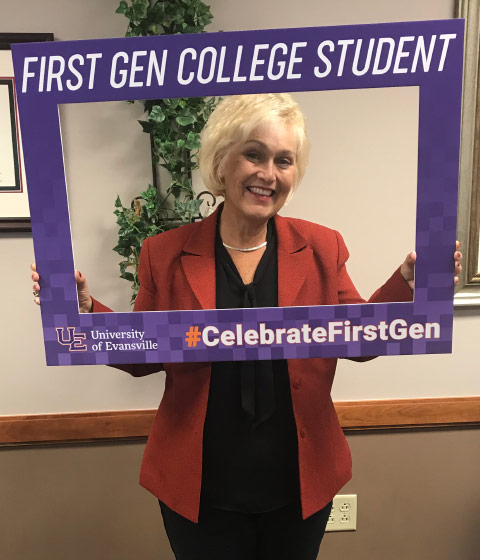 Dana Clayton holding First-gen sign