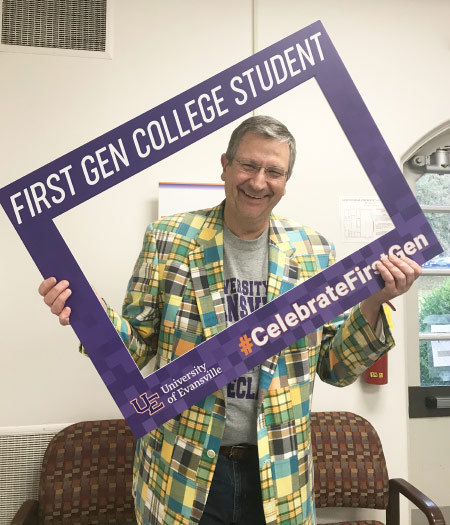 Cris Hochwender holding First-gen sign