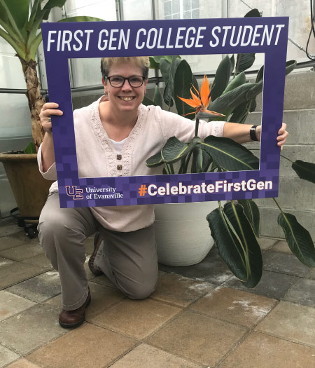 Elizabeth Powell holding First-gen sign