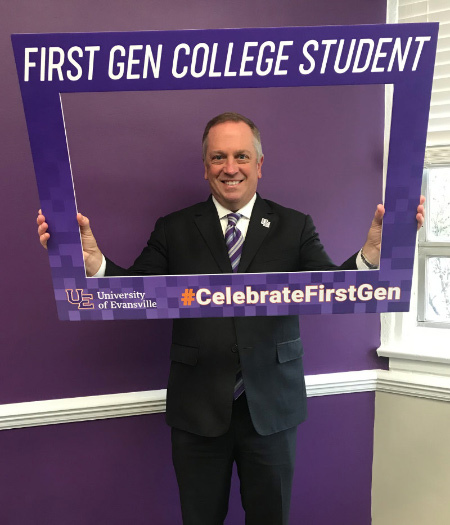 President Christopher M. Pietruszkiewicz holding First-gen sign