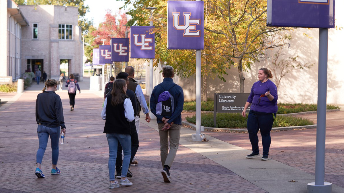 Campus tour guide giving a tour.