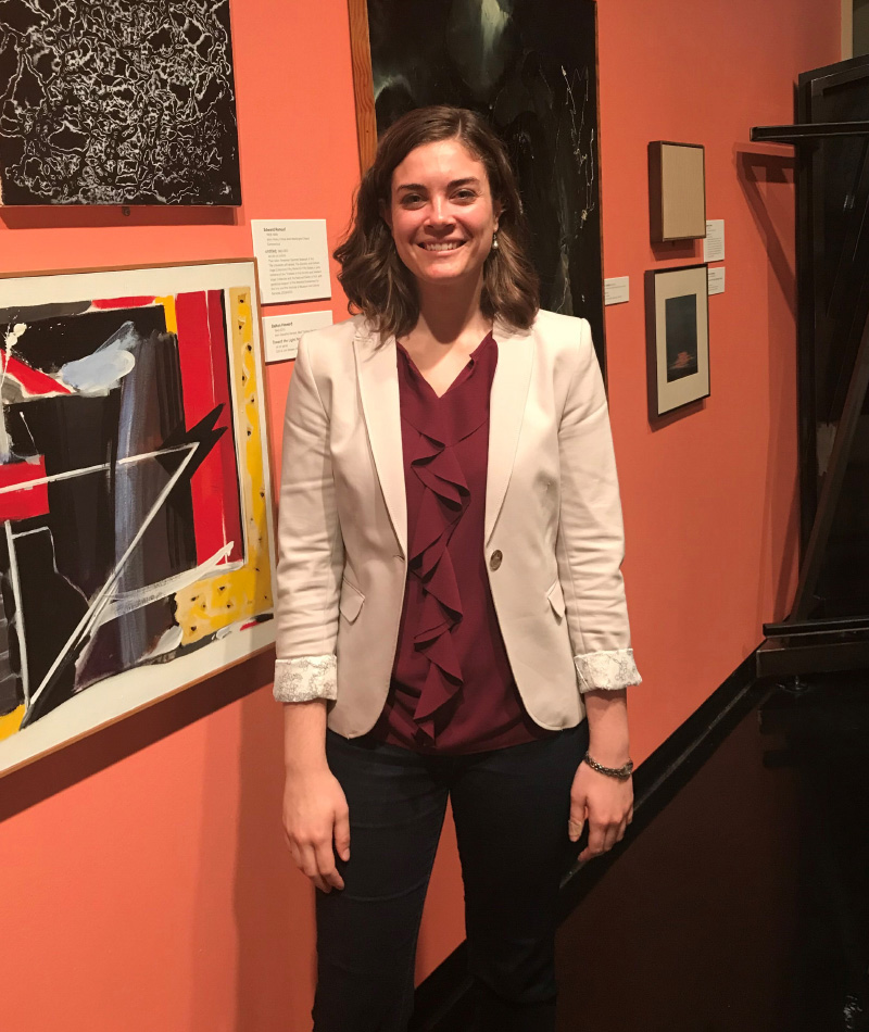 Elizabeth Long standing by artwork