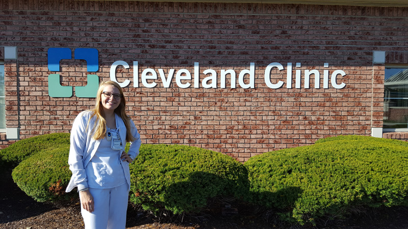 Elizabeth Crooks in front of Cleveland Clinic