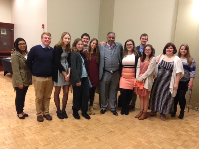 Anthony Ray Hinton and UE students pose for a picture at the reception following his presentation..