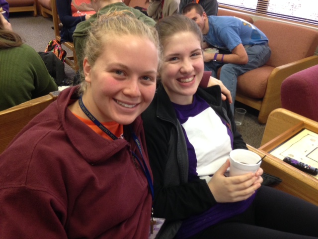Two students enjoy food and camaraderie at the Honors Breakfast Club.