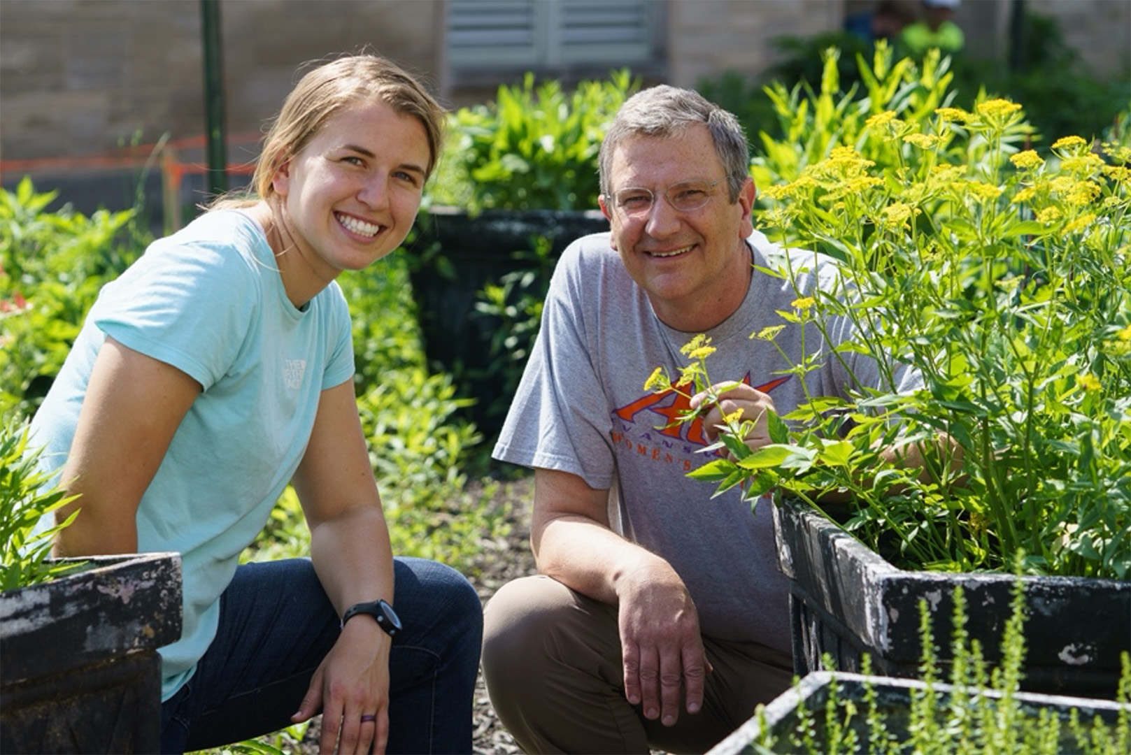 Cris Hochwender with student in garden