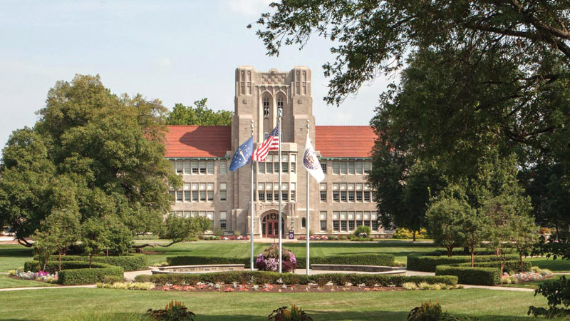 Olmsted Administration Hall with flags