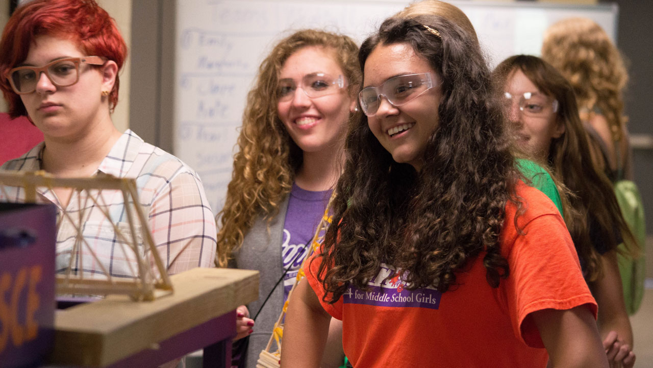 Female students during bridge building challenge.