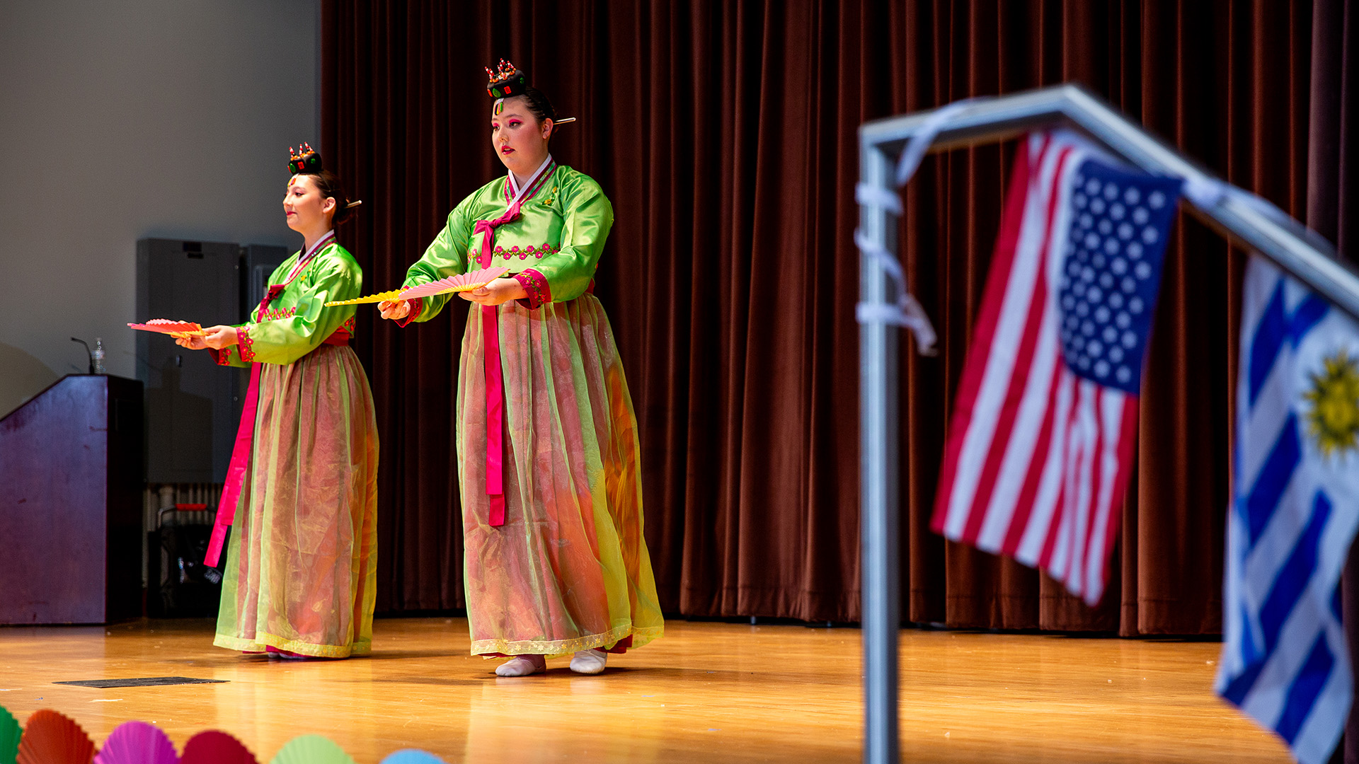 International Bazaar students on stage performing
