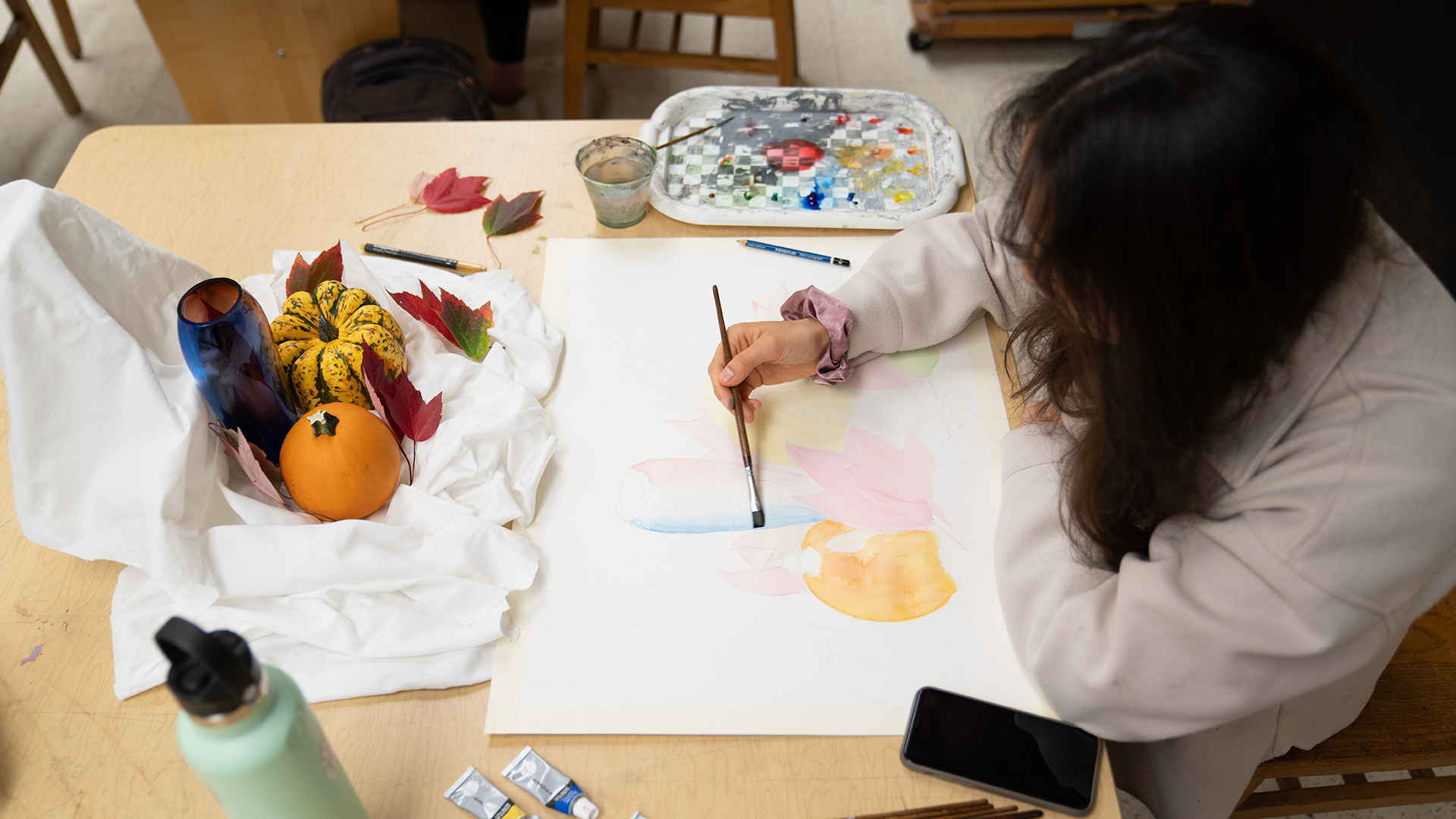 Student painting fruit