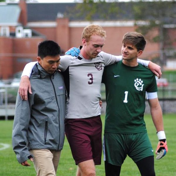 Hung Chien Wu helping athletic student