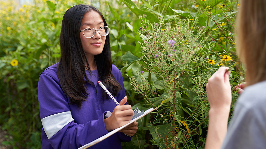 Biology student with clipboard