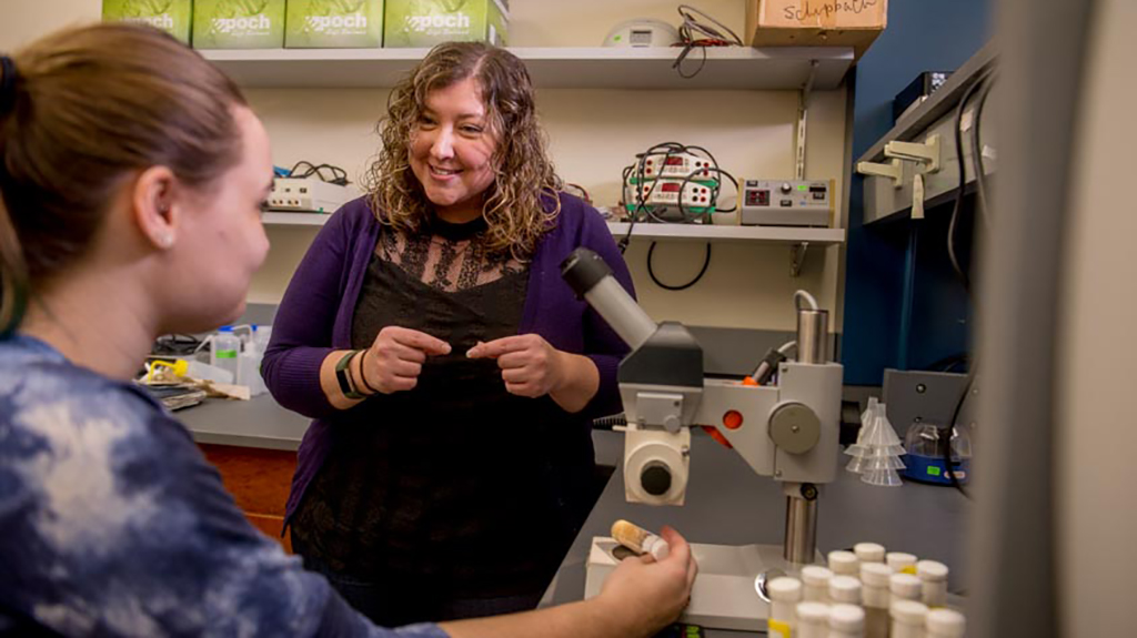 Julie Merkle with student in lab