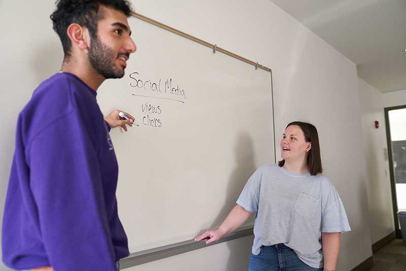 ACE Consulting students at whiteboard