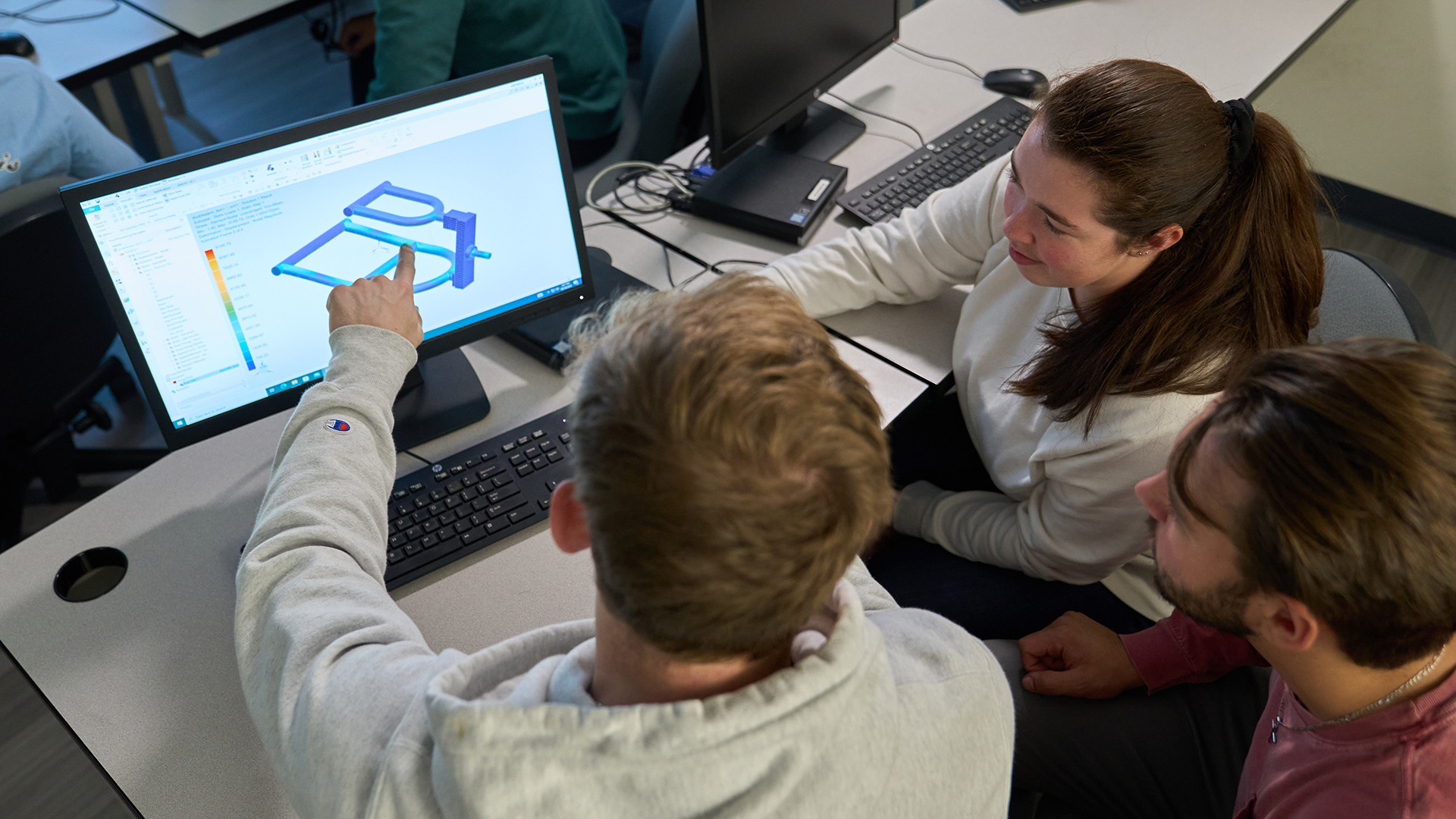 Integrated Business and Engineering Students with engineering laptop