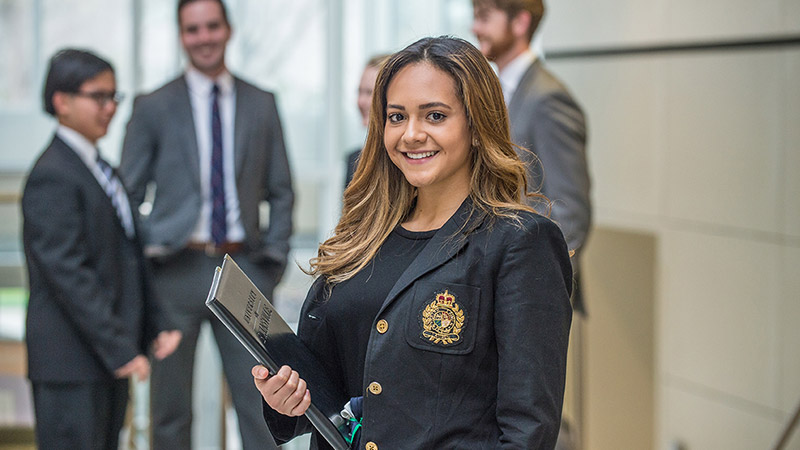 Female business student holding folder