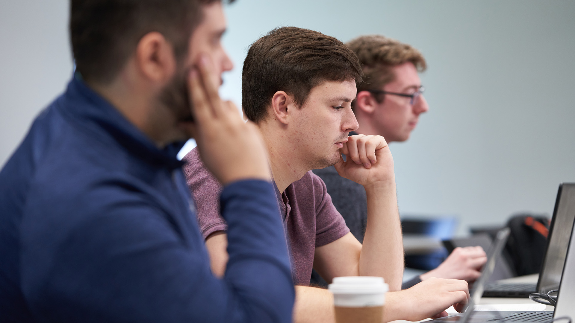 Business students in class with laptops