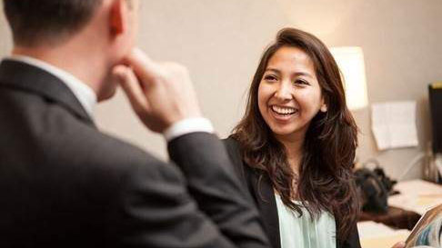 Students in meeting smiling