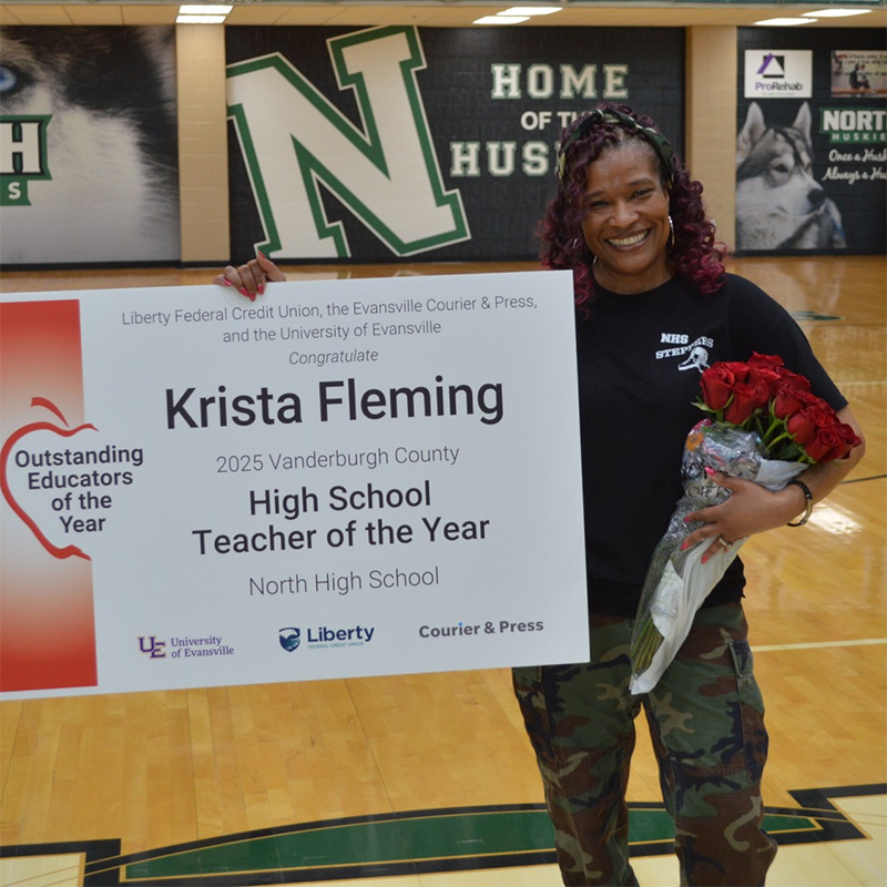 Krista Fleming holding award
