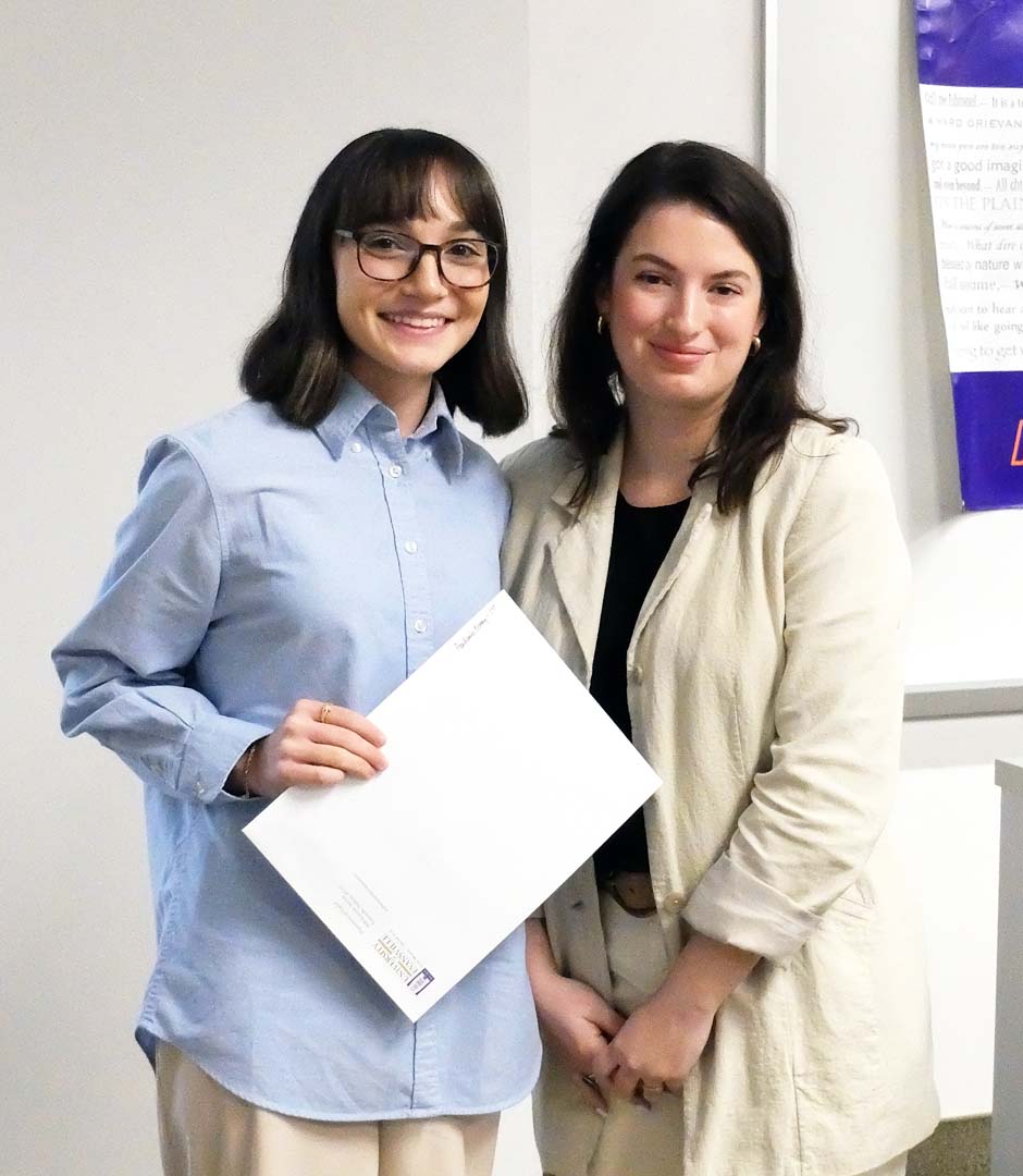 Isabelle Koch receiving her First Place in Academic Writing Grabill Award from Prof. Clara Strong.