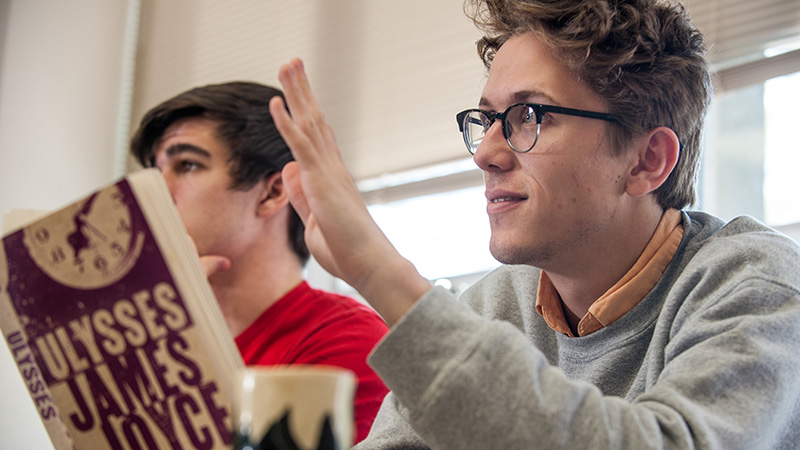 Student holding Ulysses book