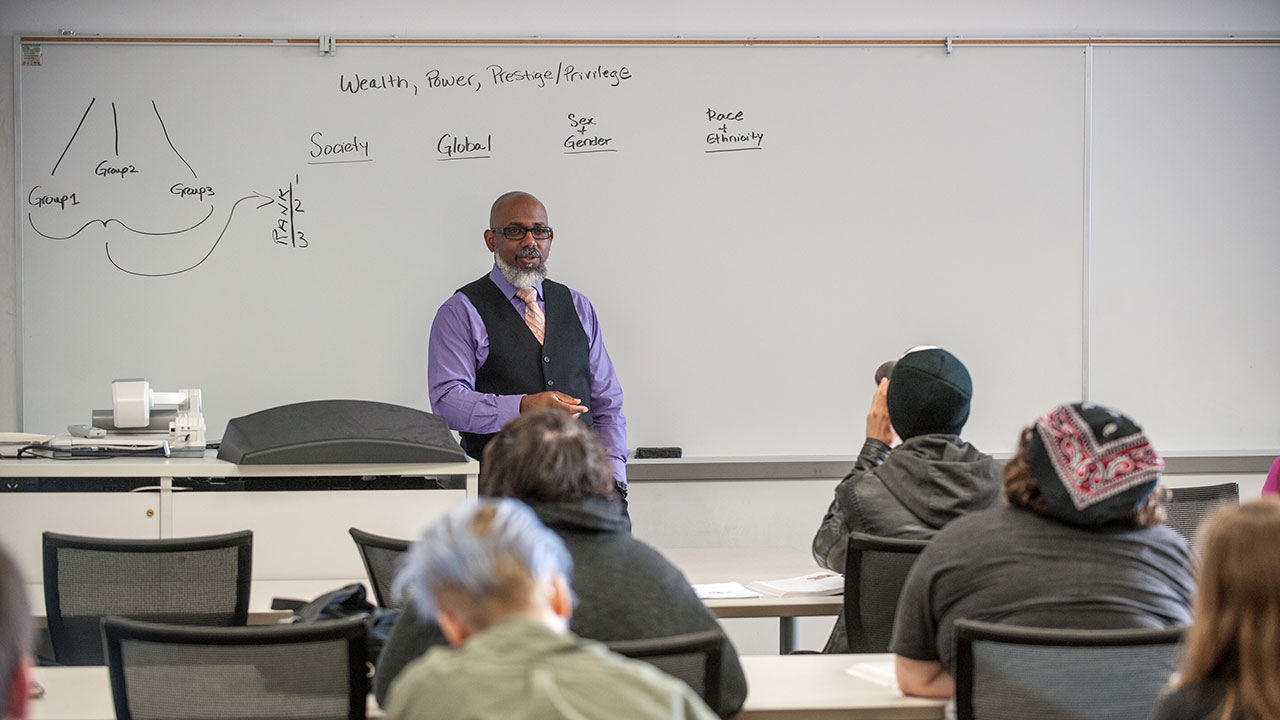 Rob Shelby teaching a sociology class