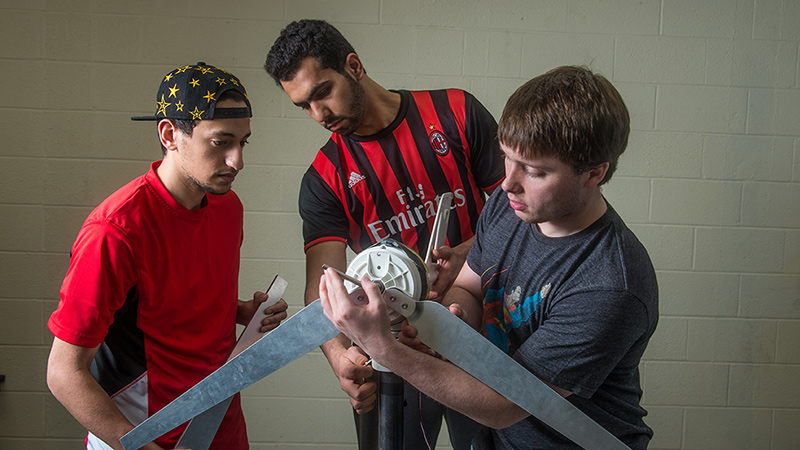 Students assembling the props of a wind turbine
