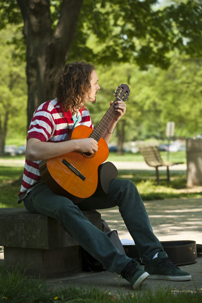 Music minor playing guitar