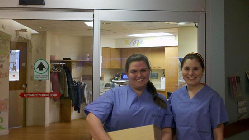 Two happy nurses in a hospital