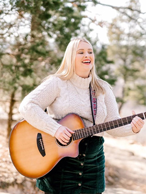 Bailee Bostic playing guitar