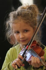 Girl child playing violin