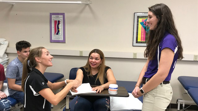 Ace CARE student checking pulse