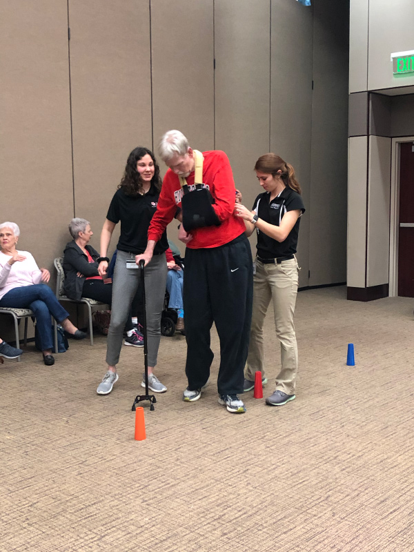 Students assisting patient walking
