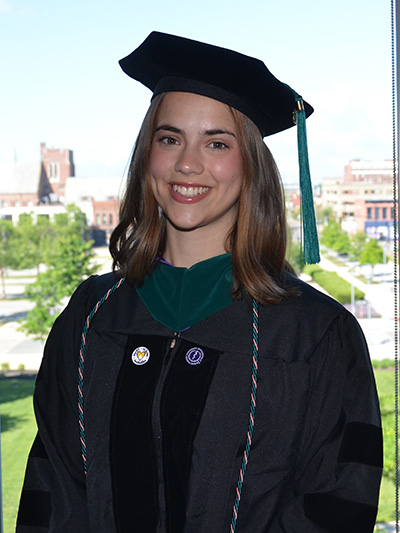 Clara Oberg in graduation regalia