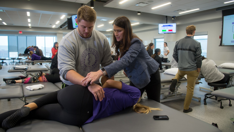 Instructor and student with patient