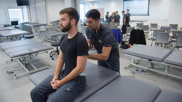 PA student listening to patient breathing