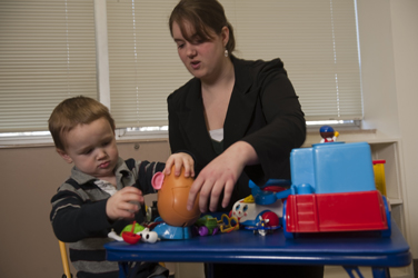 Student and child in Hennon lab