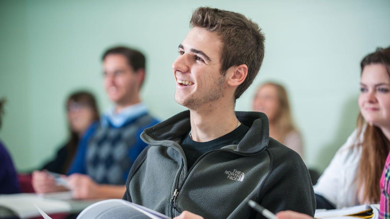 Smiling student in class