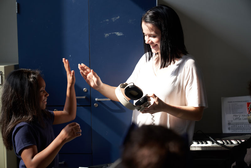 Student giving high-five