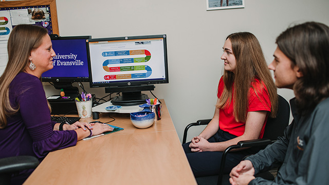 Students meeting with advisor