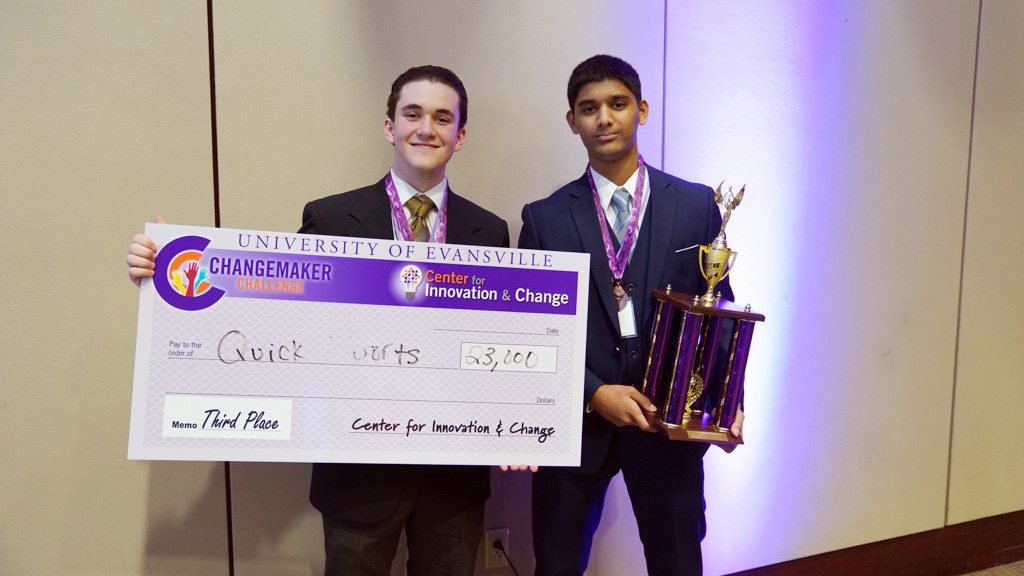 3rd place winners holding check and trophy.